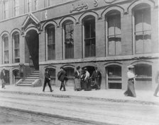 Massachusetts. Lynn. shoe factories, 1895?: sidewalk scene outside Luddy Co., (1895?). Creator: Frances Benjamin Johnston.