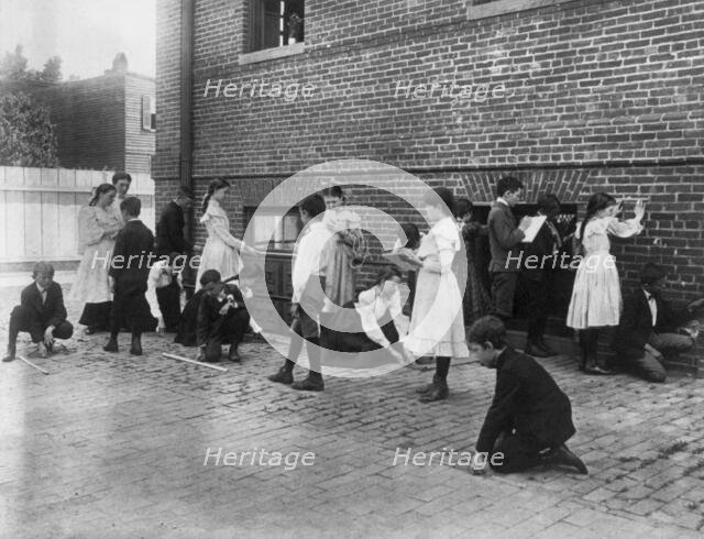 Students of 8th Division school using rulers, yardsticks, and measuring..., Washington, DC, (1899?). Creator: Frances Benjamin Johnston.