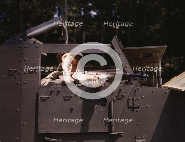 Halftrack infantryman with Garand rifle, Ft. Knox, Ky., 1942. Creator: Alfred T Palmer.