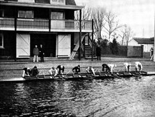 The Universities' Boat-Race: the Cambridge crew at practice - putting in the boat, 1895. Creator: Stearn.