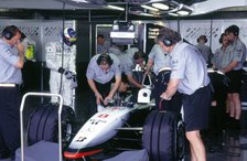 McLaren MP4 13, Mika Hakkinen in pits during practice for 1998 British Grand Prix. Creator: Unknown.