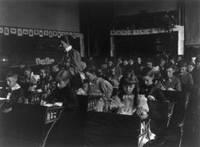 7th Division grade school pupils working in classroom, Washington, D.C., (1899?). Creator: Frances Benjamin Johnston.