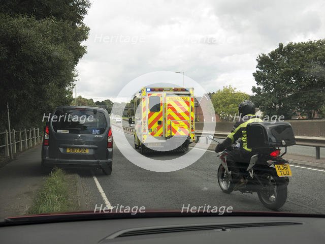 Ambulance attending road traffic accident, A35 Hampshire 2017. Creator: Unknown.