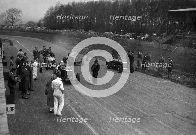 MG Q type, Frazer-Nash Shelsley and Bugatti Type 51 on the starting grid at Donington Park, 1930s. Artist: Bill Brunell.