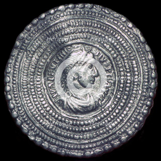 Cast silver disc-brooch. Artist: Unknown