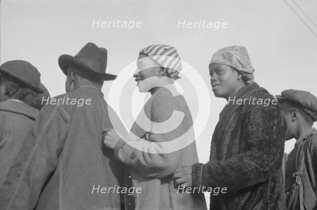 Possibly: Negroes in the lineup for food at mealtime in the camp..., Forrest City, Arkansas, 1937. Creator: Walker Evans.