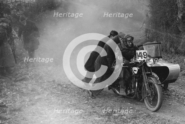 Motorcycle and sidecar receiving a push during a trial, c1930s. Artist: Bill Brunell.