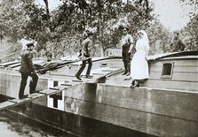 Patients being taken on board a hospital barge, Somme campaign, France, World War I, 1916. Artist: Unknown