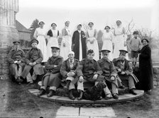 Convalescent soldiers and nursing staff, Nathaniel Lloyd's house, Great Dixter, East Sussex, 1916. Artist: Nathaniel Lloyd