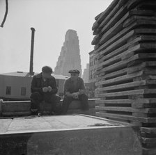 Gloucester fishermen resting on their boat at the Fulton fish market, New York, 1943. Creator: Gordon Parks.