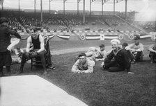 Boxer Joe Welling, amid Cleveland baseball players in stadium, 1918. Creator: Bain News Service.