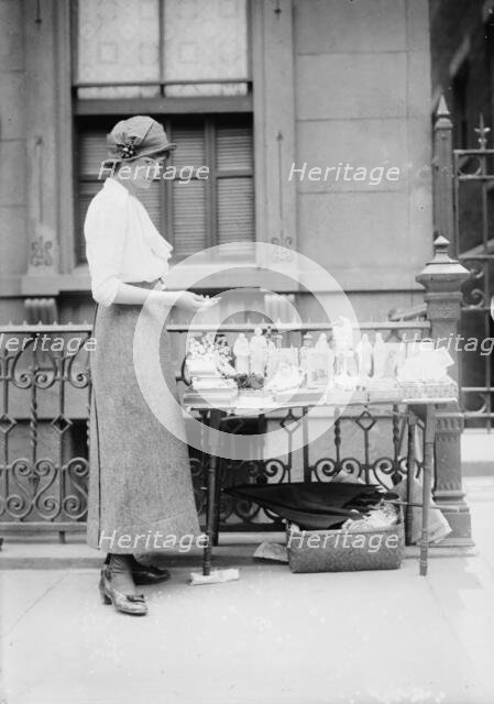Selling medals etc. before St. Anne's, between c1910 and c1915. Creator: Bain News Service.