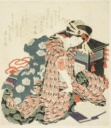 Young woman reading "The Pillow Book (makura no soshi)", Japan, 1822. Creator: Hokusai.