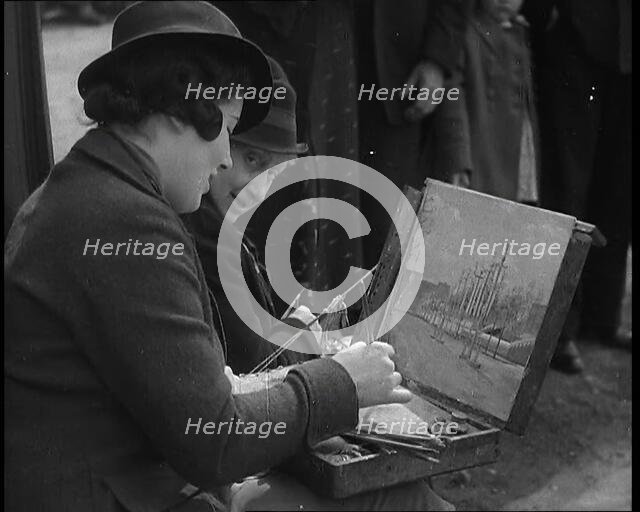 A Woman Artist Sitting at the Side of the Mall Painting the Scene While Watched By Several..., 1937. Creator: British Pathe Ltd.
