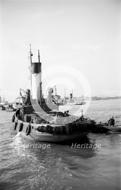 A tug leaving the Royal Terrace Pier at Gravesend, Kent, c1945-c1965. Artist: SW Rawlings