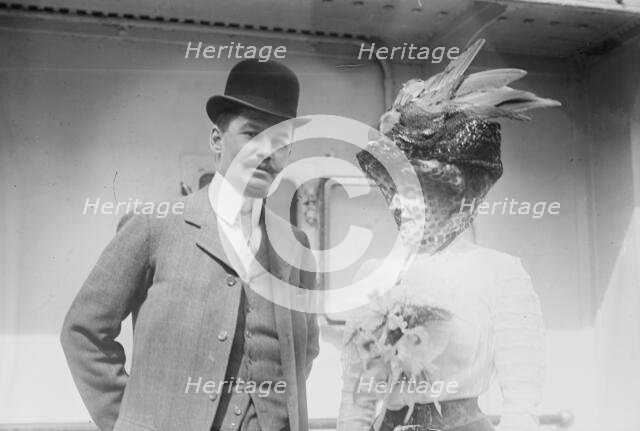 Mr. and Mrs. C.F. Bishop next to train, 1910. Creator: Bain News Service.