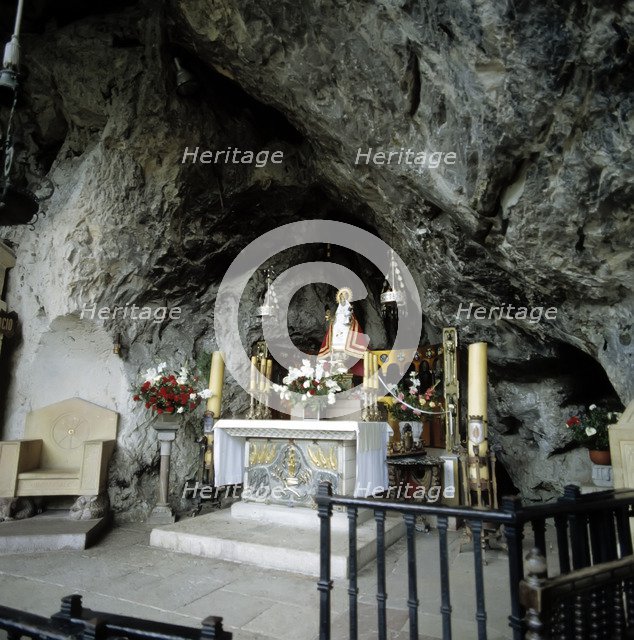 Interior of the Holy Cave of Covadonga with the image of the Virgin.