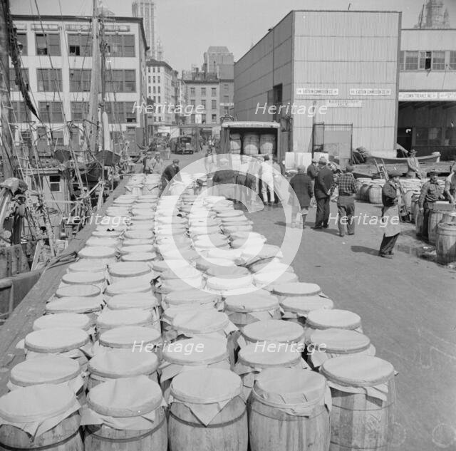 Barrels of fish on the docks at Fulton fish market ready to be shipped to retailers, New York, 1943. Creator: Gordon Parks.