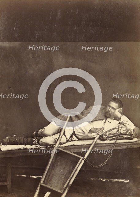 Hard Labor Convict Lying on a Bunk While Chained to a Wheelbarrow, 1891. Creator: Aleksei Kuznetsov.