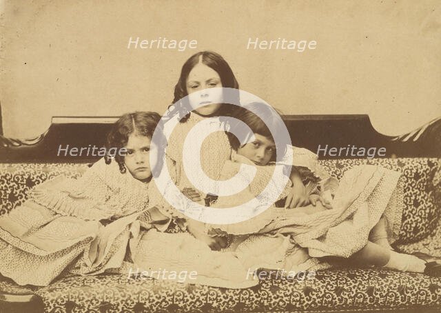 Edith, Ina and Alice Liddell on a Sofa, Summer 1858. Creator: Lewis Carroll.