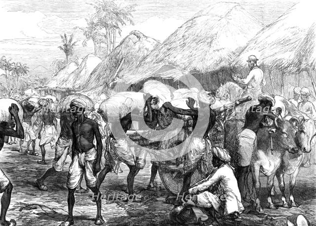 The Famine in Bengal: loading grain-carts near Calcutta, 1874. Creator: Unknown.