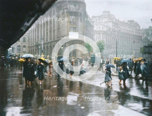 One of Londons wet days. From the album: Photograph album - London, 1920s. Creator: Harry Moult.