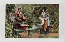"Cleanliness is next to Godliness".  Women in Welsh costume washing in tubs on bench, c1900s Creator: Unknown.