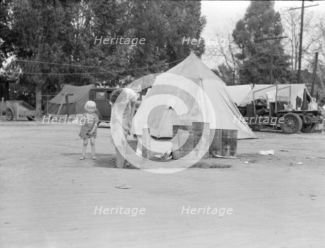 Texas drought refugees in cotton camp near Exeter, California, 1936. Creator: Dorothea Lange.