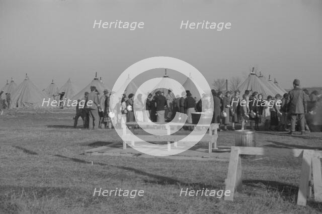 Possibly: Refugees lined up at meal time in the camp for white flood...Forest City, Arkansas, 1937. Creator: Walker Evans.