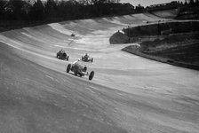 CS Staniland's Bugatti Type 37A leading a Benz and Jack Dunfee's Ballot, Brooklands, 1930. Artist: Bill Brunell.