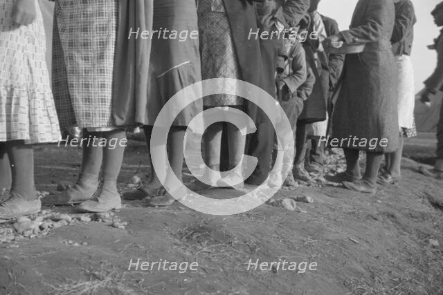 Possibly: Negroes in the lineup for food at meal time in the camp..., Forrest City, Arkansas, 1937. Creator: Walker Evans.