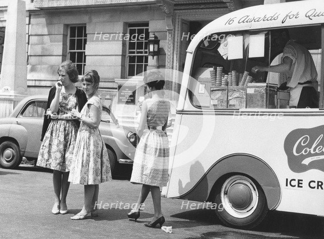Young women by an ice cream van, c1960.