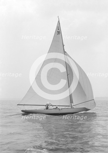 The 6 Metre 'Lanka' sailing with spinnaker, 1914. Creator: Kirk & Sons of Cowes.
