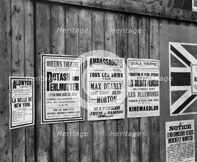 Playbills on a hoarding, London, World War I, 1914. Artist: Adolph Augustus Boucher.
