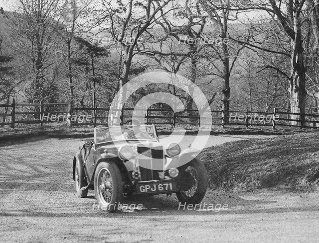 MG TA of FW Ellis competing in the RAC Rally, 1939. Artist: Bill Brunell.