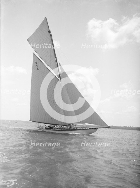 The early 12 Metre cutter 'Cintra' sailing close-hauled, 1911. Creator: Kirk & Sons of Cowes.