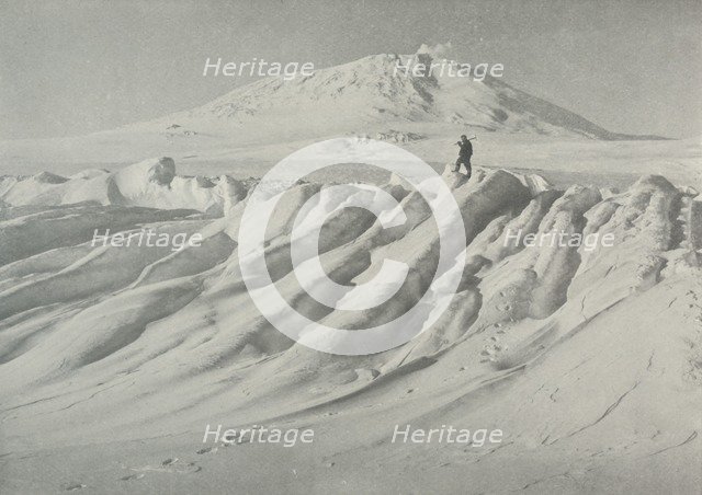 'Mount Erebus Over a Water-Worn Iceberg', October 1911, (1913). Artist: Herbert Ponting.