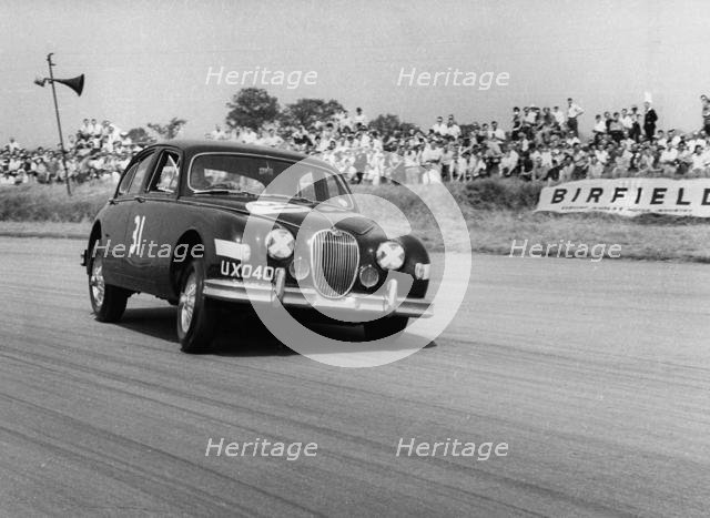 Jaguar Mk1 racing at Silverstone. Creator: Unknown.