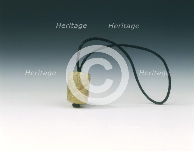 Jade bead with spiralling decoration, Western Zhou dynasty, China, c1100-771 BC. Artist: Unknown