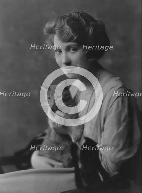Bainter, Fay, Miss, with Buzzer the cat, portrait photograph, 1916. Creator: Arnold Genthe.