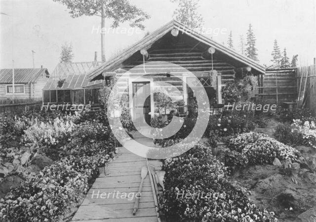 Log cabin, between c1900 and 1923. Creator: Unknown.