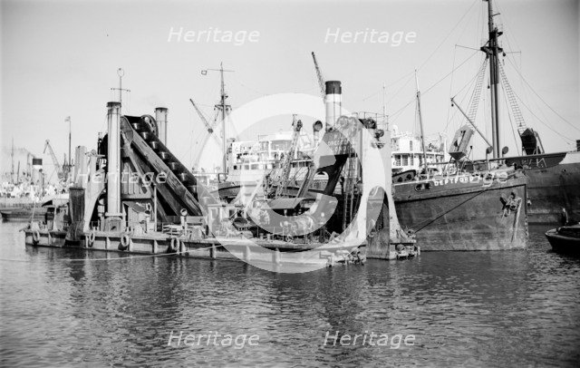 A dredger moored in Tilbury Docks, Essex, c1945-c1965. Artist: SW Rawlings