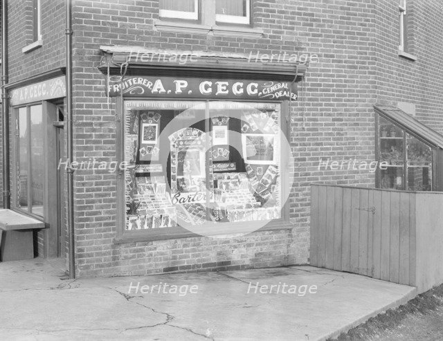 Decorated shop window of AP Gegg, c1935. Creator: Kirk & Sons of Cowes.