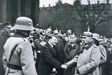 Adolf Hitler shaking hands with President von Hindenburg on the State Day of Honour, 1934. Artist: Unknown