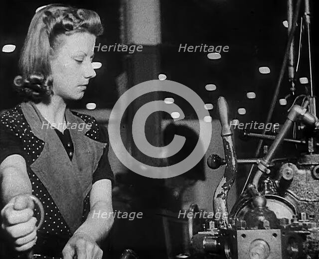Woman Working in a Factory, 1940. Creator: British Pathe Ltd.