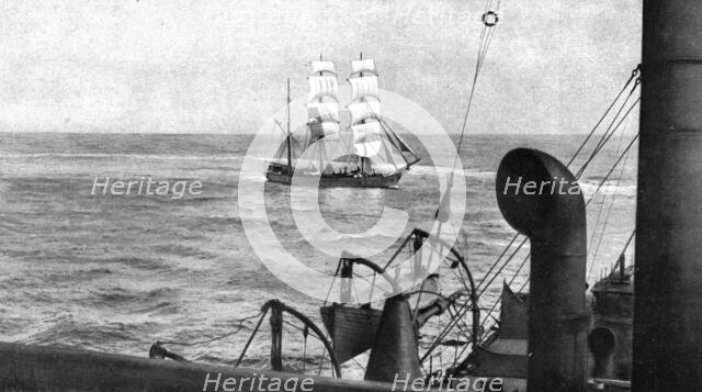 At sea; During boarding, a patrol cruiser turns on the visiting vessel which it encircles..., 1917. Creator: Unknown.