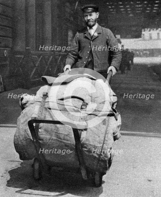 A train porter, London, 1926-1927. Artist: Unknown