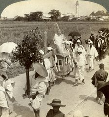 Funeral procession of a rich Buddhist, on the road to Sakai, looking towards Osaka, Japan, 1904.Artist: Underwood & Underwood