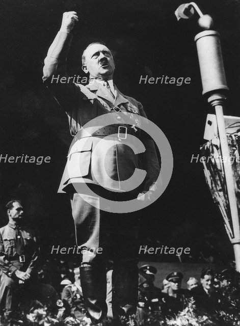 Adolf Hitler addressing a Nazi rally at Nuremberg, Germany, 1930s. Artist: Unknown