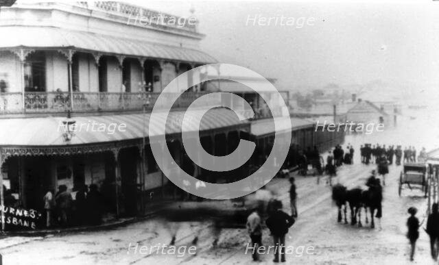 Spectators watch rising floodwaters in Melbourne Street, South Brisbane, 1890. Creator: John Jackson Hogg.